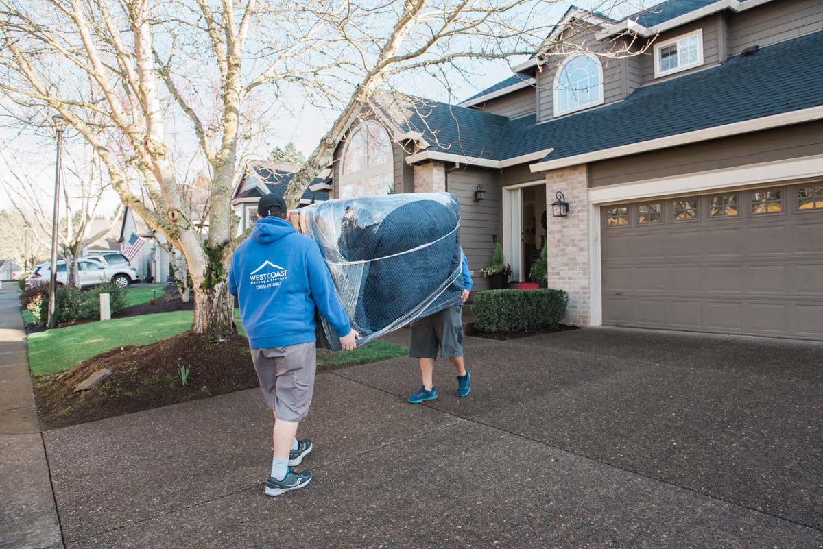 Local furniture movers carrying sofa in Portland, Oregon